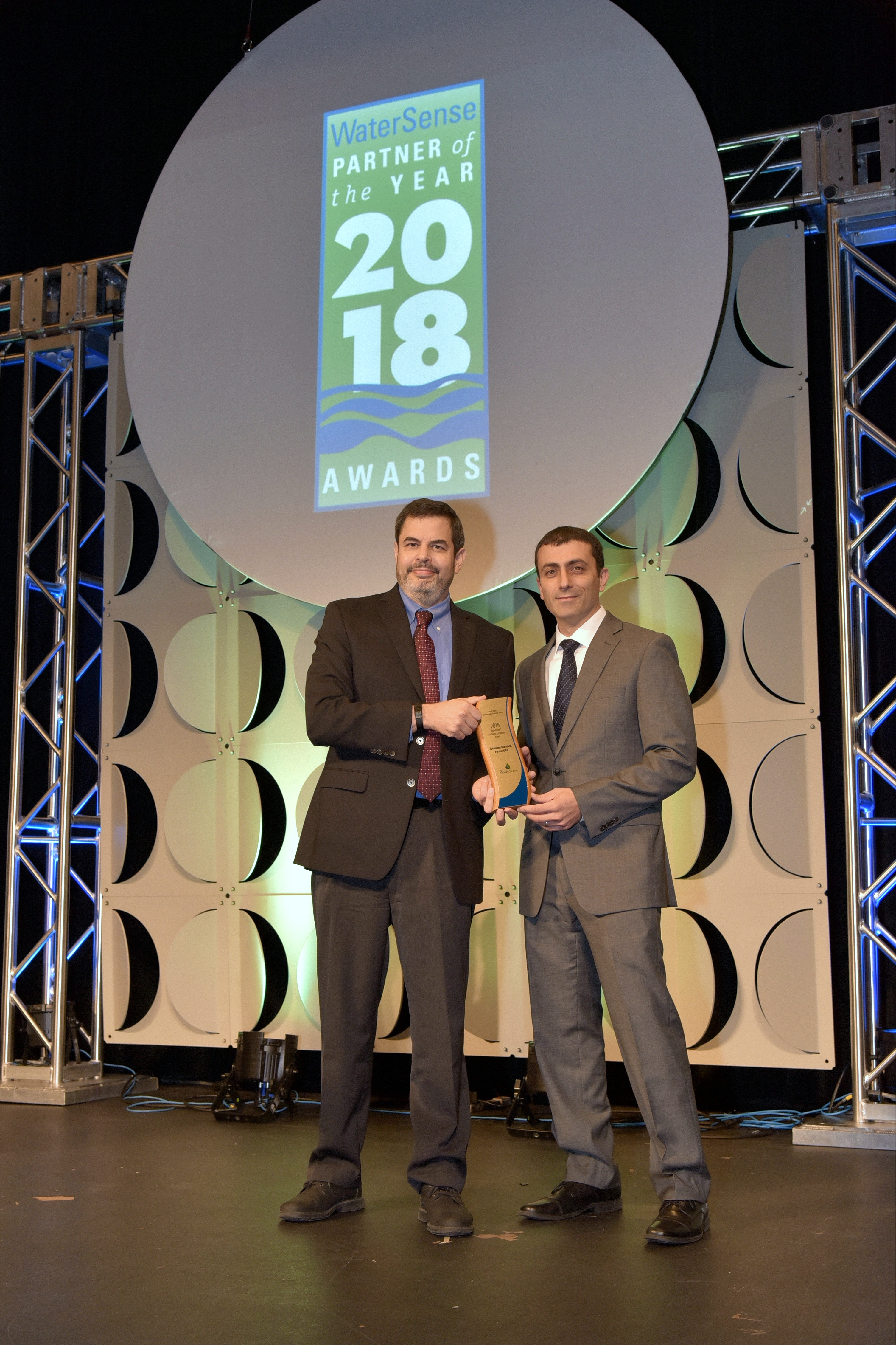 Sal Gattone accepts Sustained Excellence Award for American Standard, Part of LIXIL.