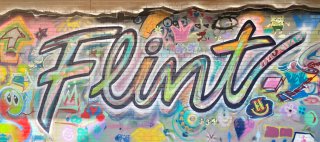 Colorful mural with the word Flint in cursive